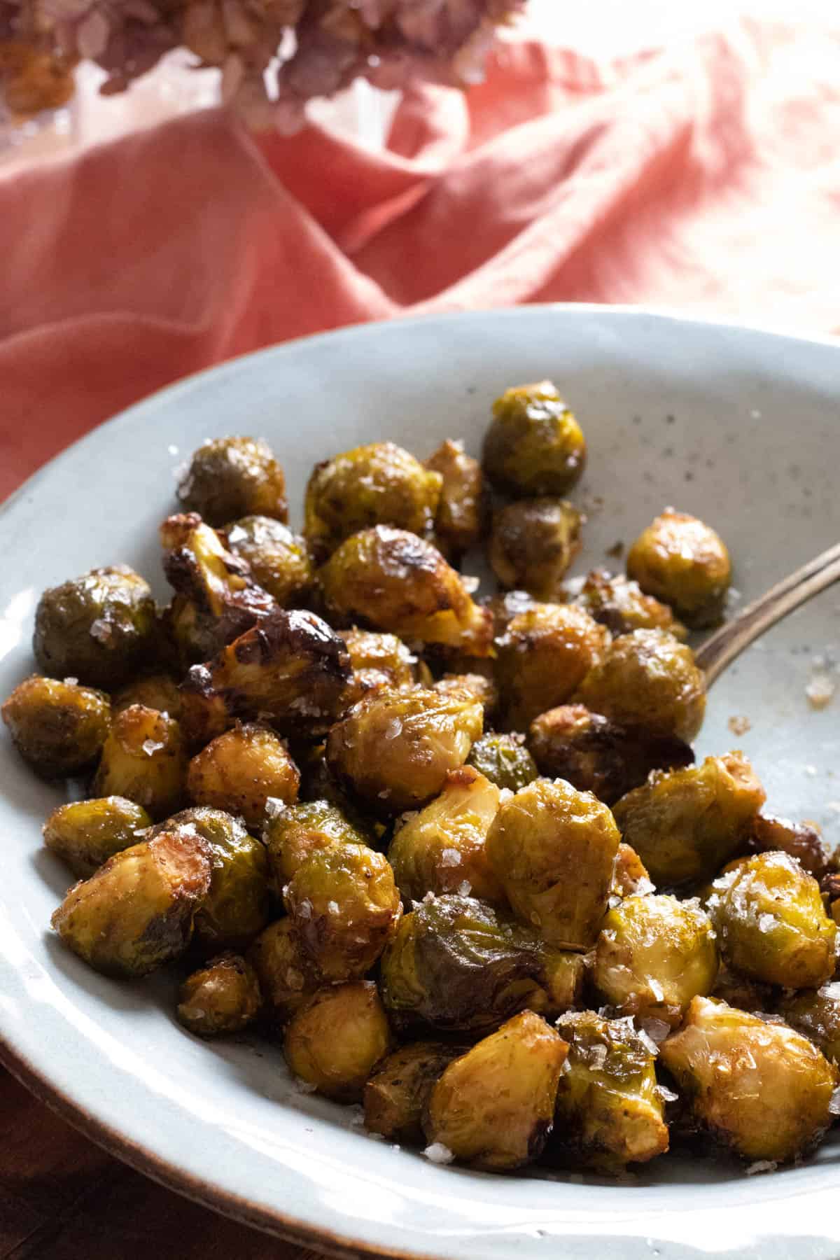 brussel sprouts on a light blue plate