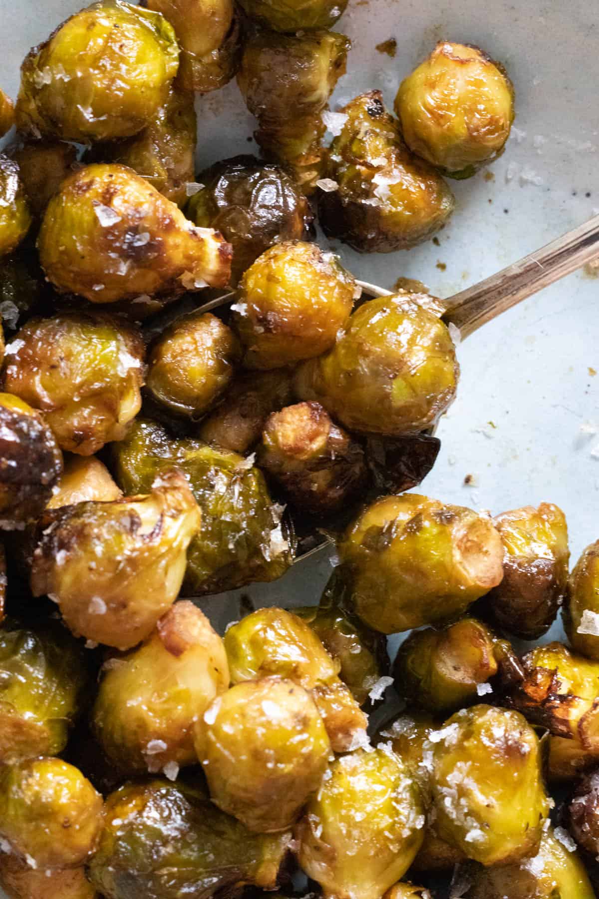 brussel sprouts on a light blue plate.