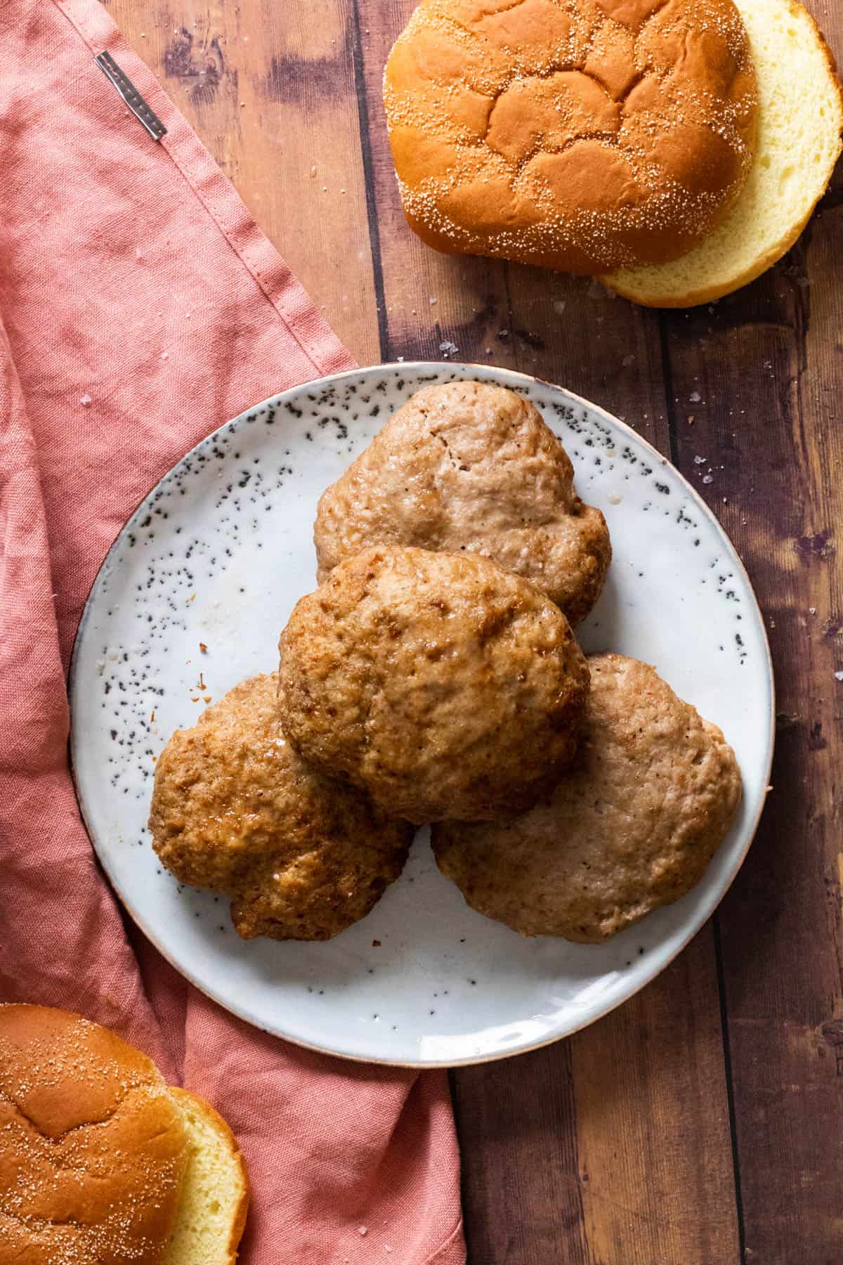 air fryer turkey burgers on a light blue plate.