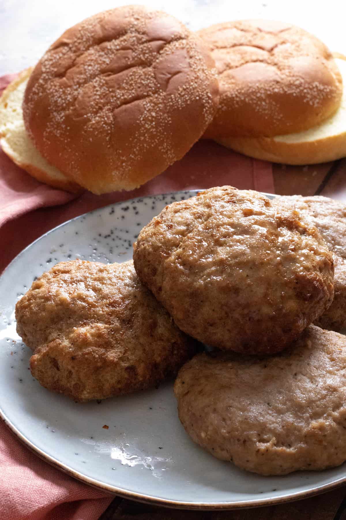 air fryer turkey burgers on a light blue plate.