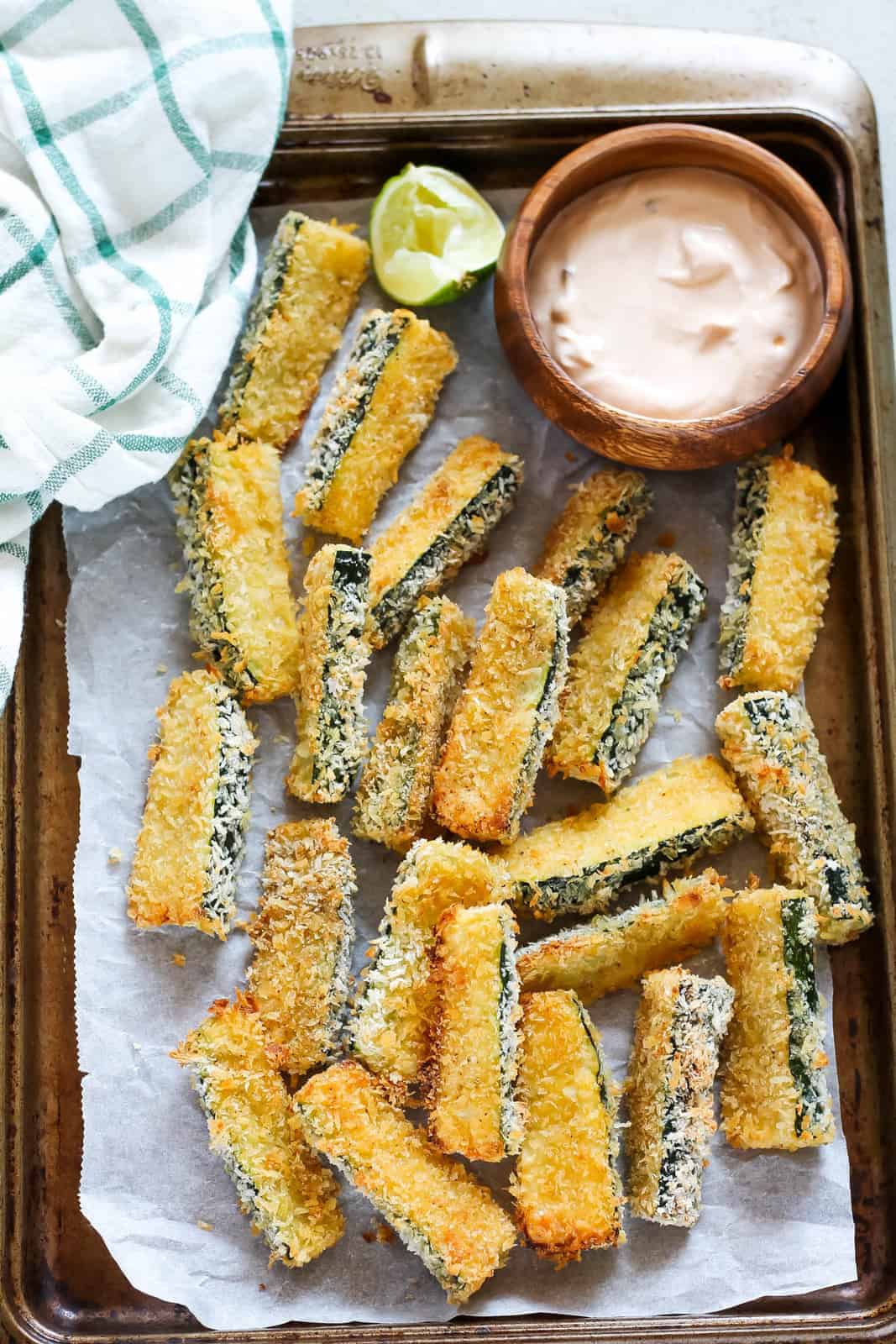 baked zucchini fries in a pan