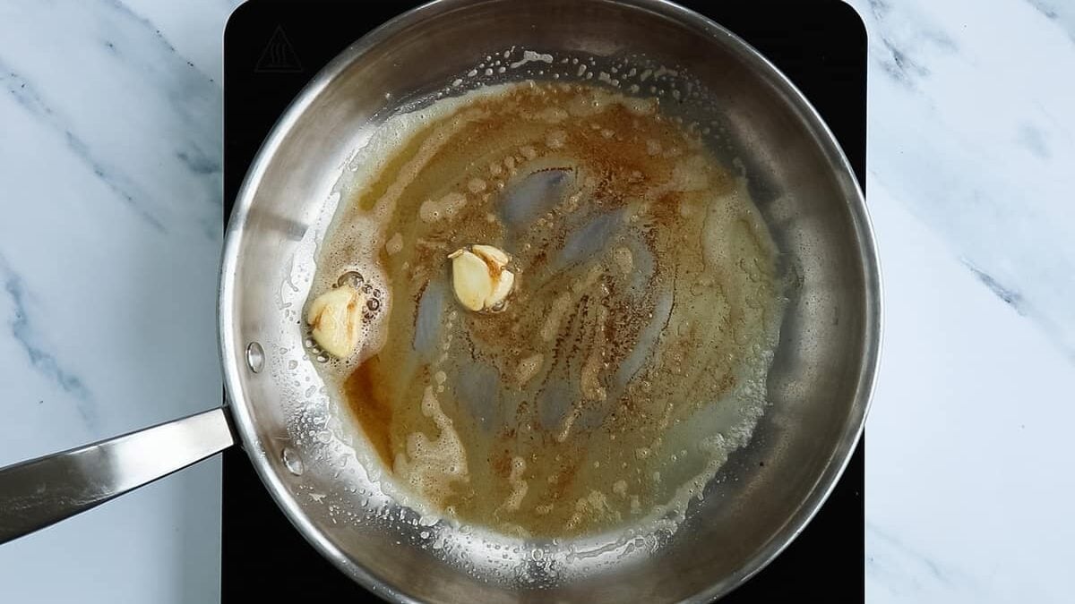 Sautéing garlic in butter.