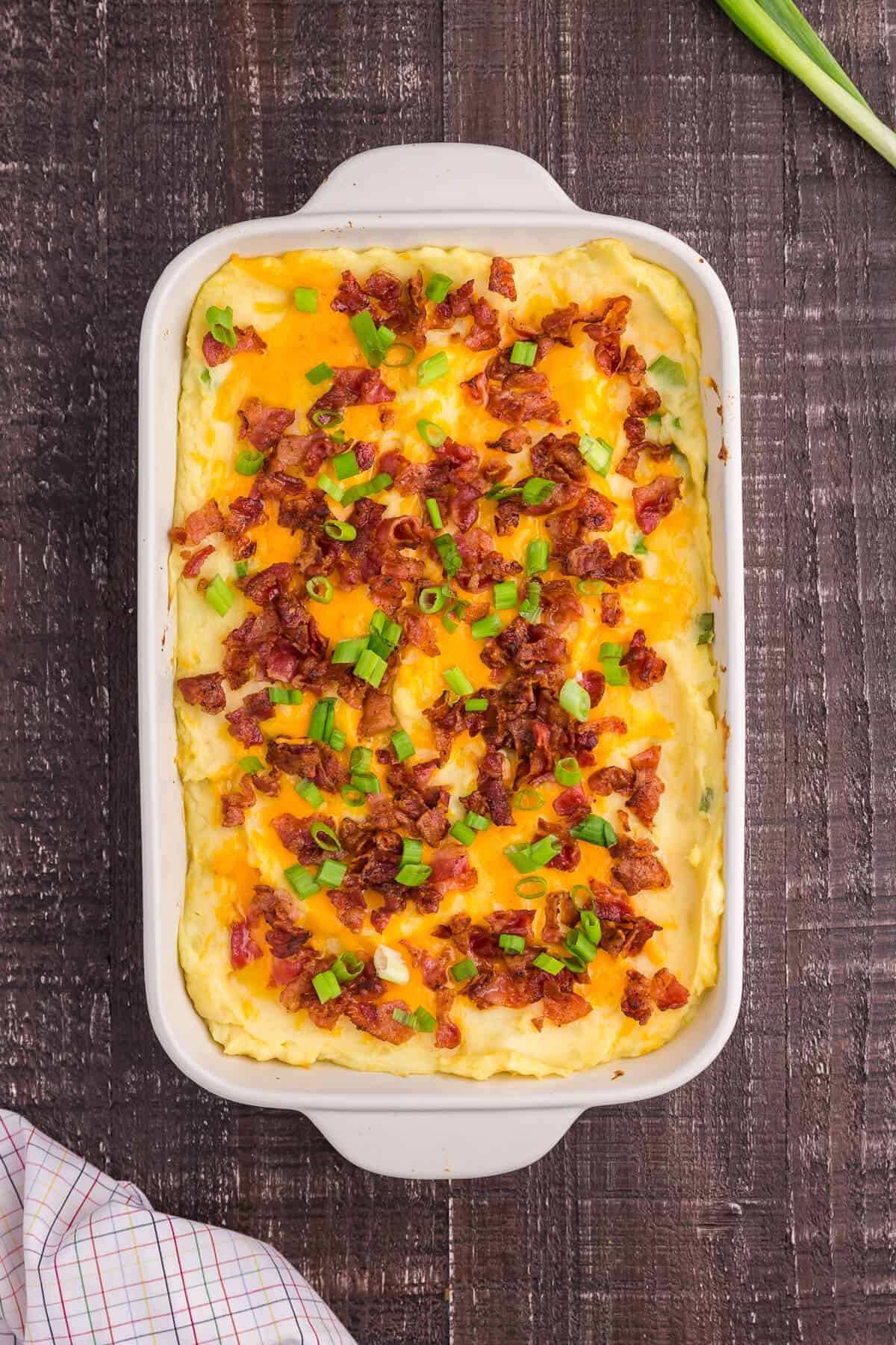 loaded mashed potatoes in a casserole dish