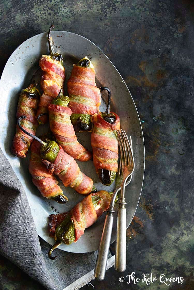 bacon wrapped jalapeño poppers on a plate
