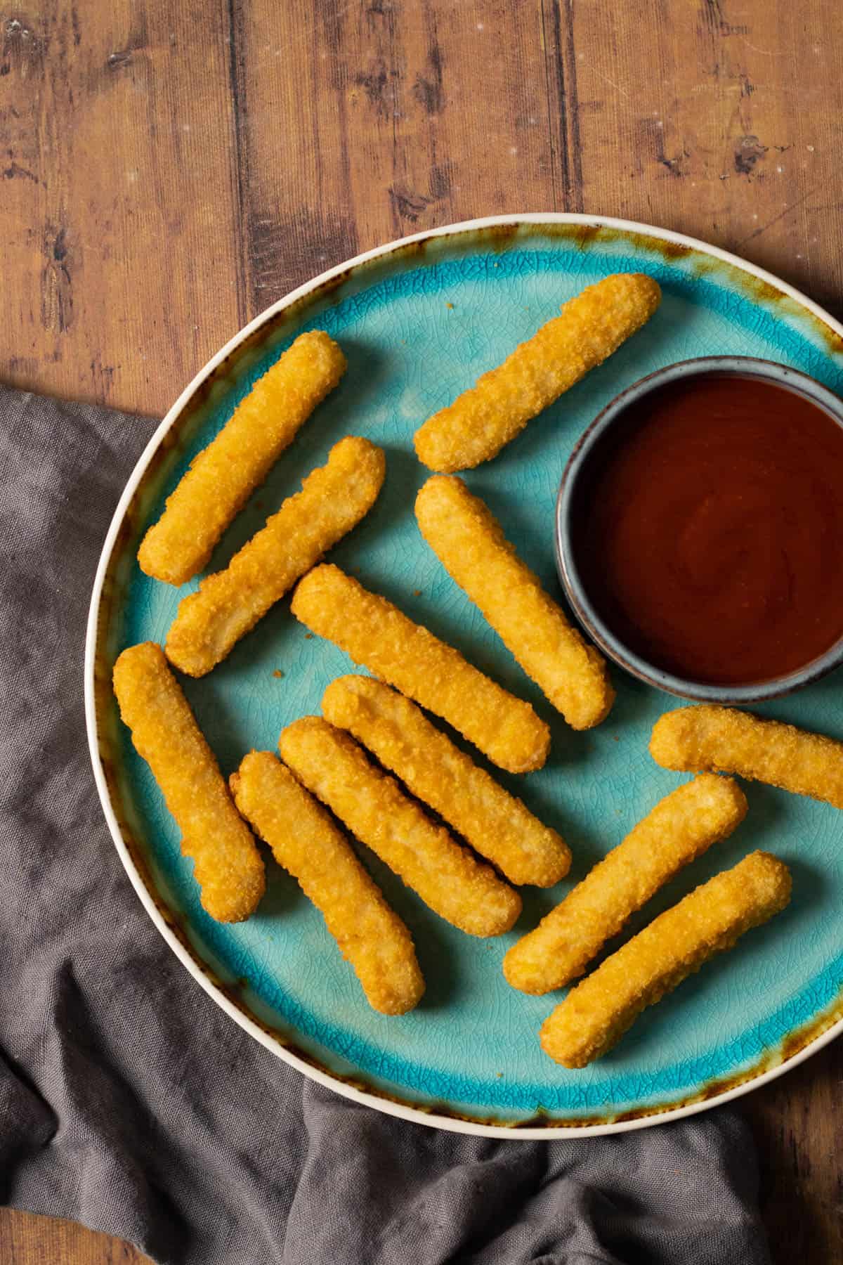 chicken fries on a blue plate.