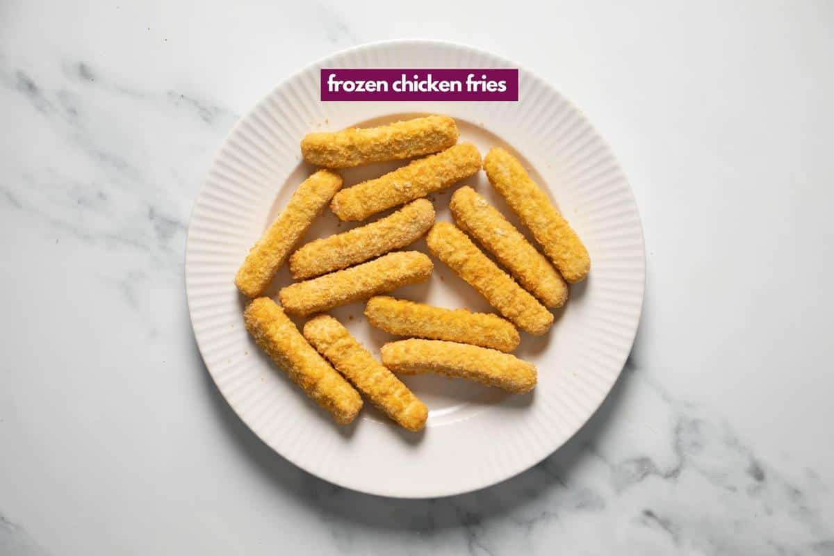 frozen chicken fries on a white plate.