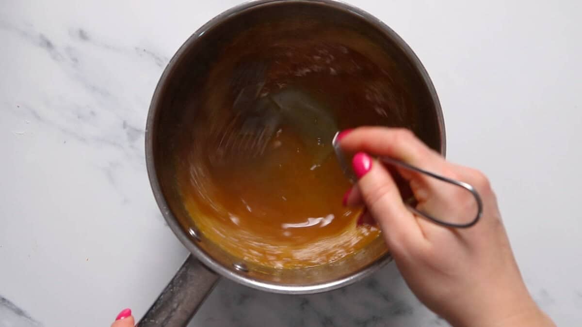Orange sauce after adding cornstarch to thicken.