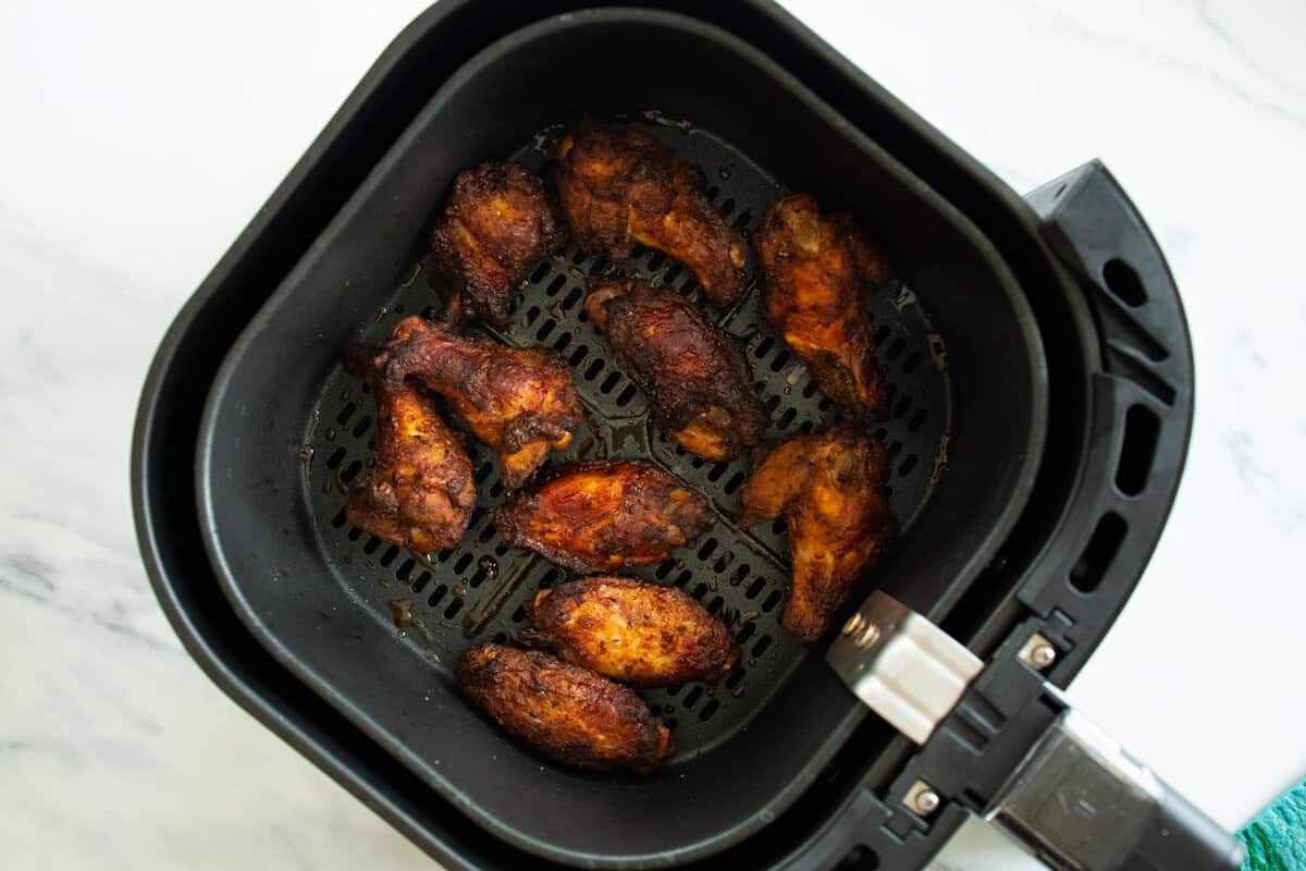 Cooked chicken wings in air fryer.