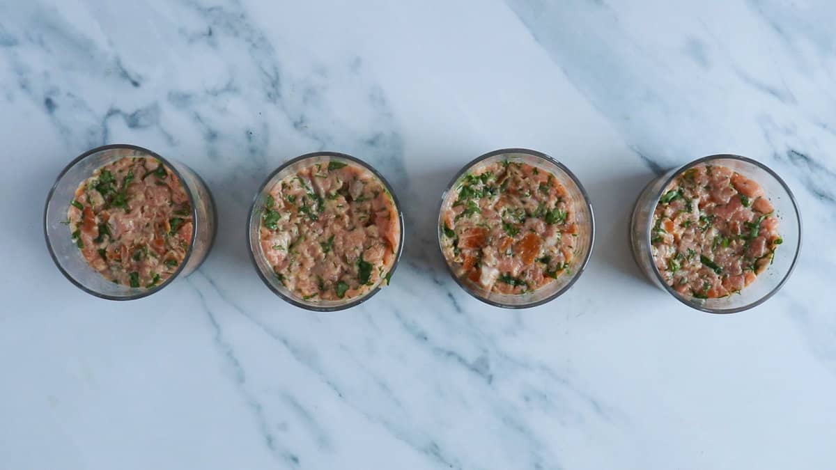 salmon tartare prepped in bowls.