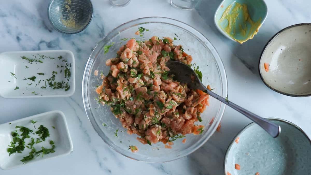 Salmon tartare mixed together in a bowl.