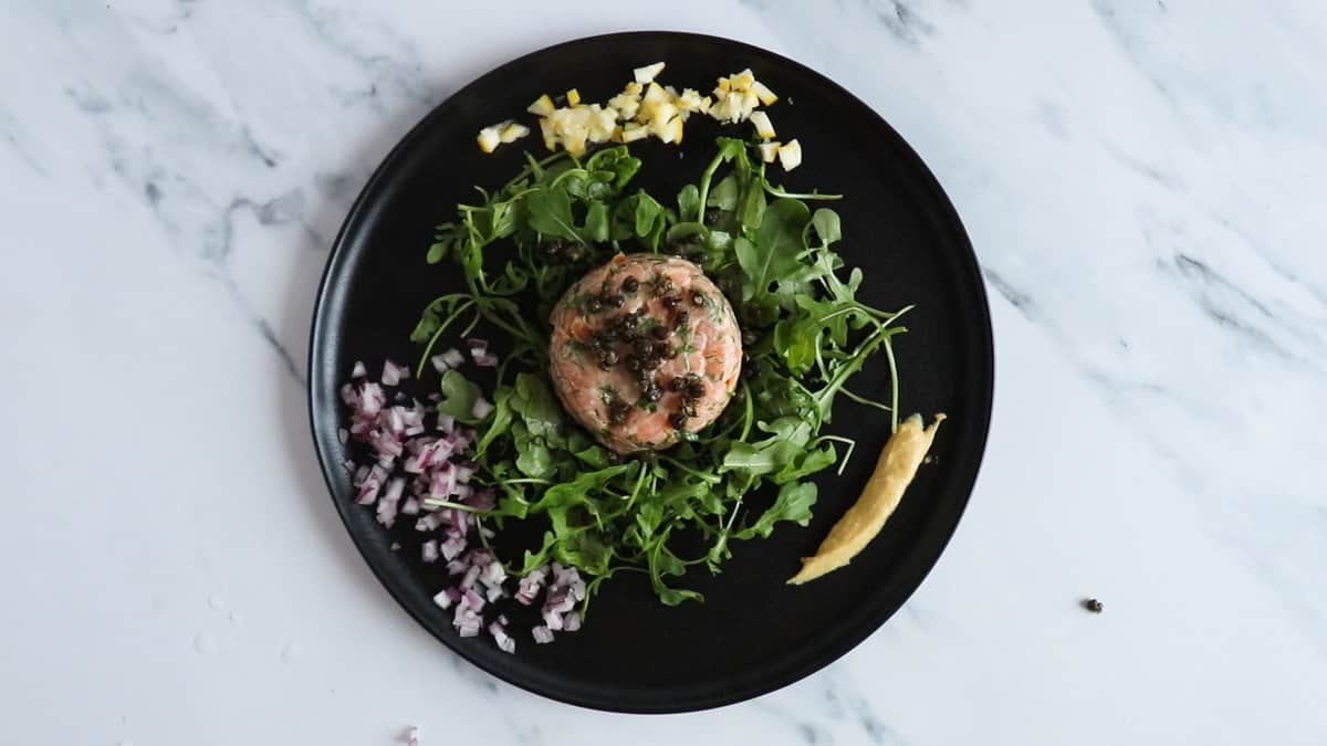 a finished salmon tartare on a plate.