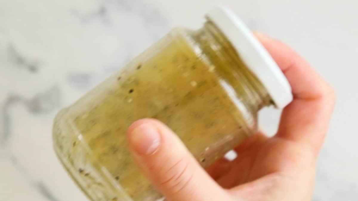 Shaking honey lemon vinaigrette.
