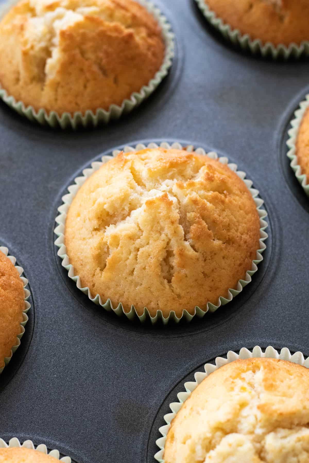 a lemon muffin in a muffin tin.