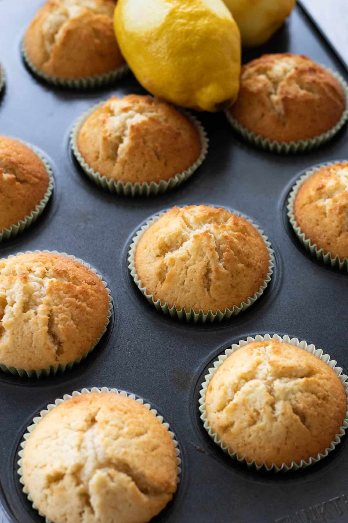 lemon muffins in a muffin tin.