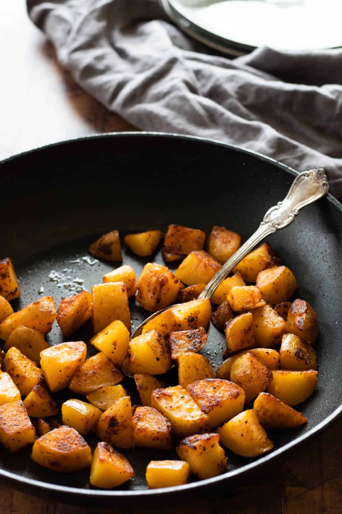 Country potatoes in a skillet.