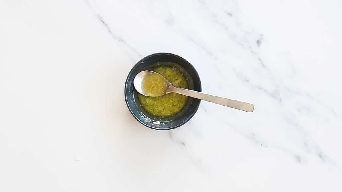 Melted butter and honey in a small bowl.