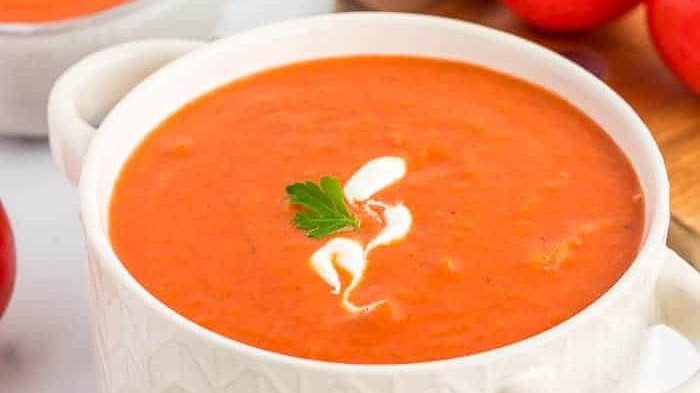 Tomato soup in a white bowl.