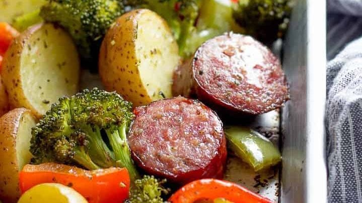 Sausage and veggies on a sheet pan.