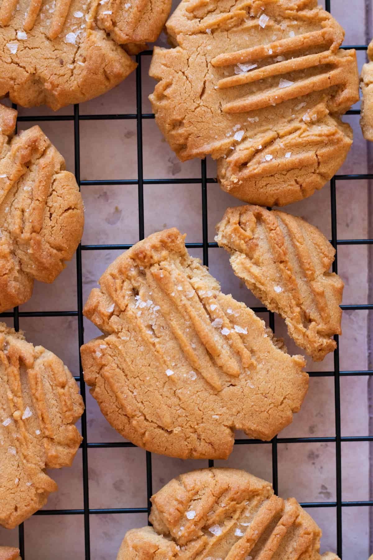Peanut butter cookies on a wire rack.