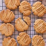 Peanut butter cookies on a wire rack.