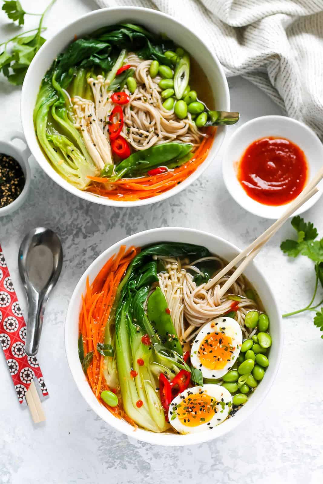 Bowls with vegetable ramen.