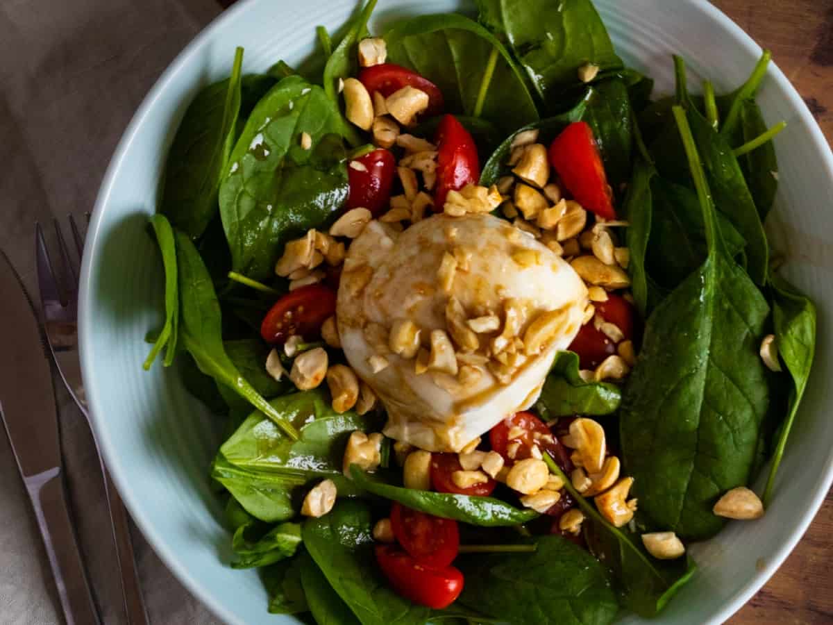 Caprese salad with cashews.