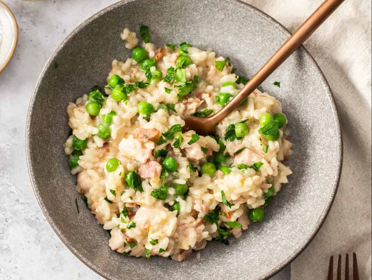 A bowl of pea and bacon risotto.