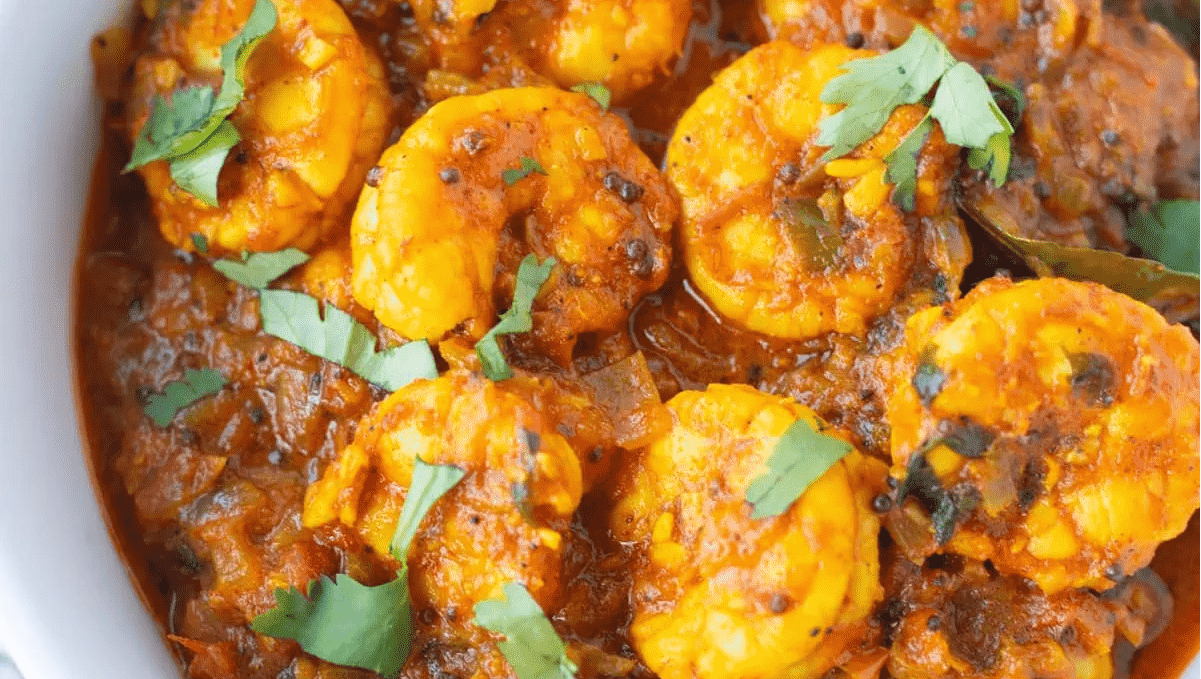 A bowl of shrimp masala curry.