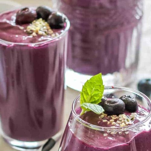 3 glasses of blueberry smoothie.