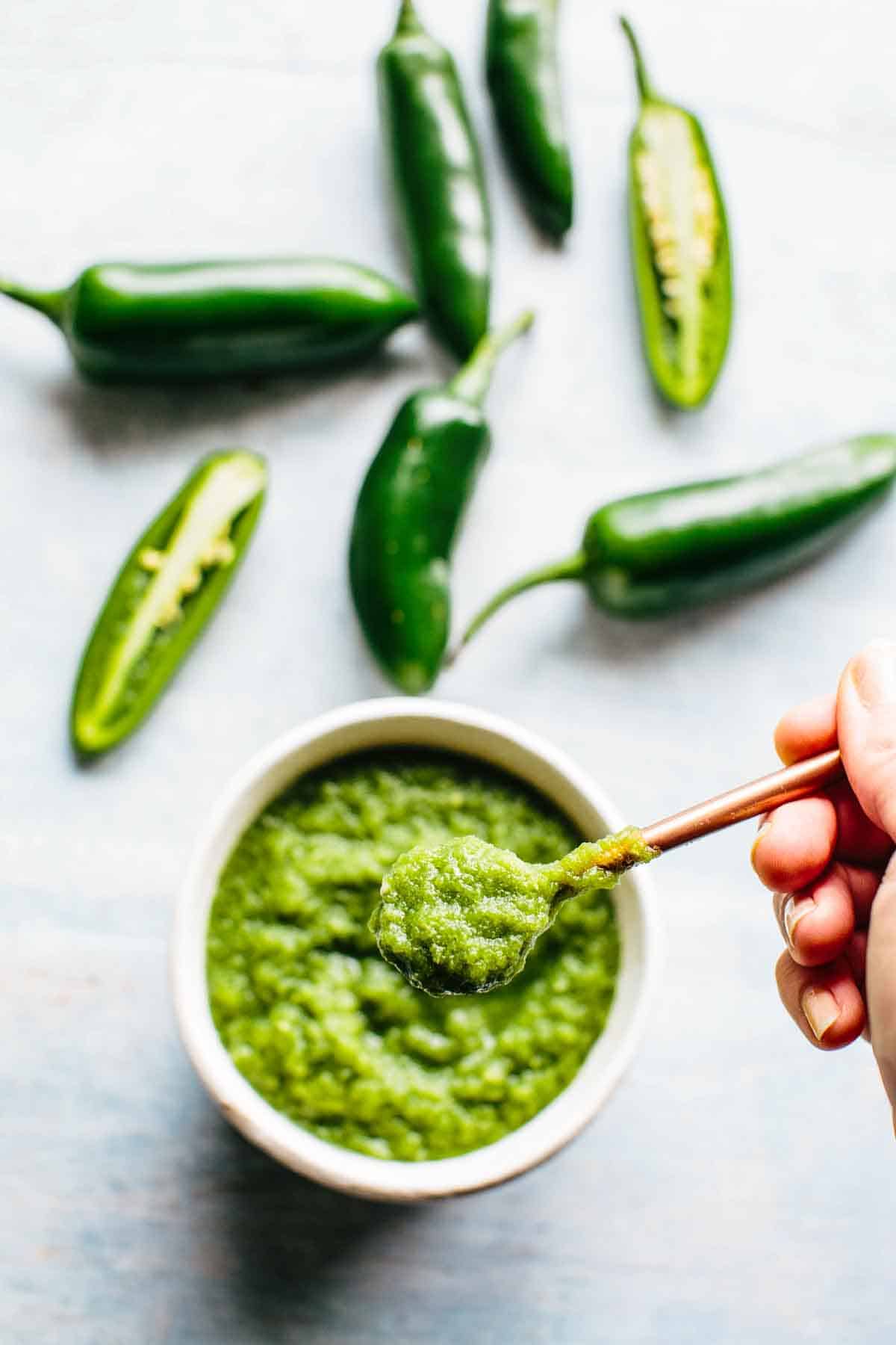 A spoonful of homemade jalapeno hot sauce.