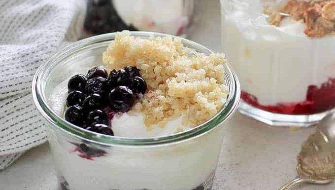 Yogurt cups with fruit and quinoa.