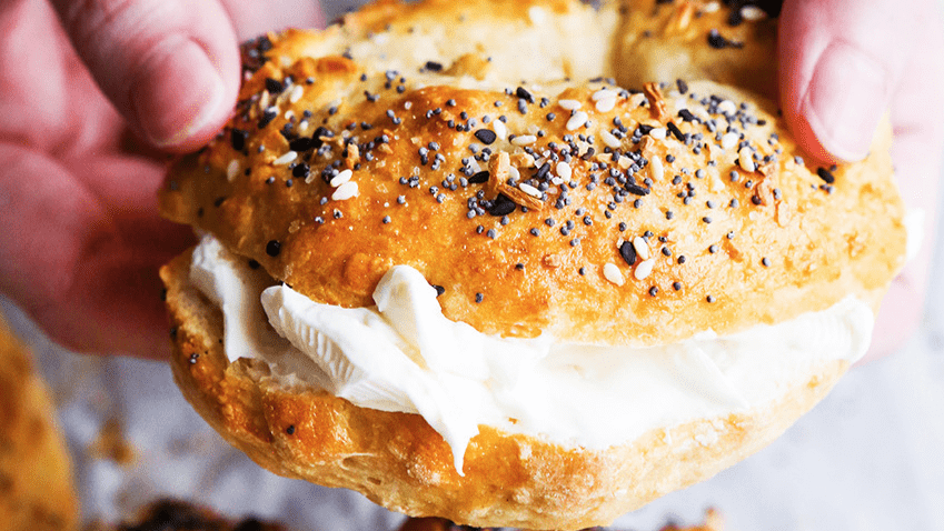 A bagel with cream cheese.