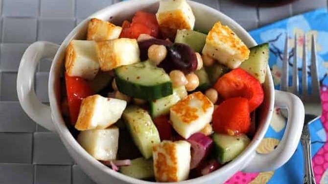 A bowl with halloumi salad.