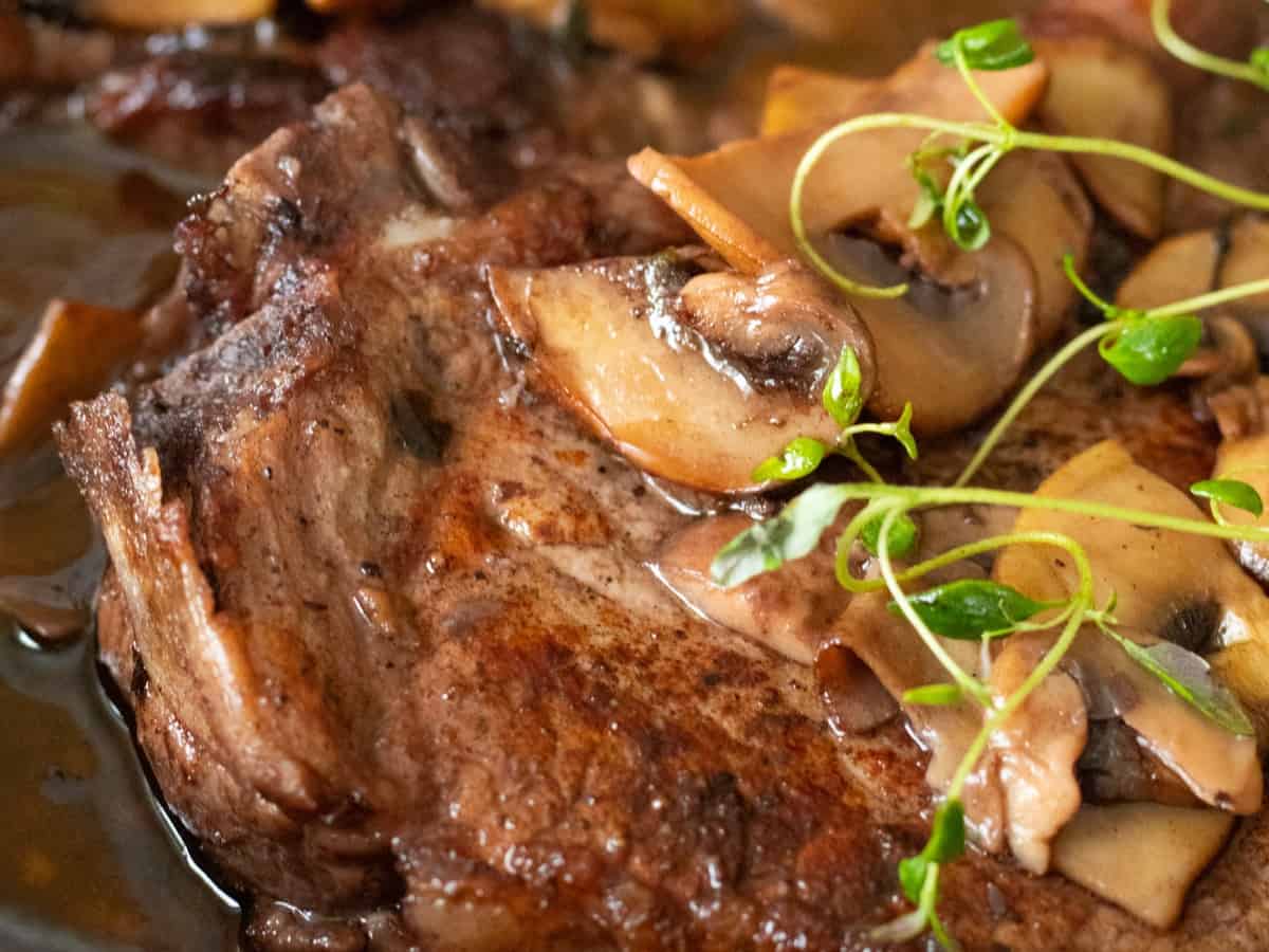 Pork chops with red wine and mushrooms.