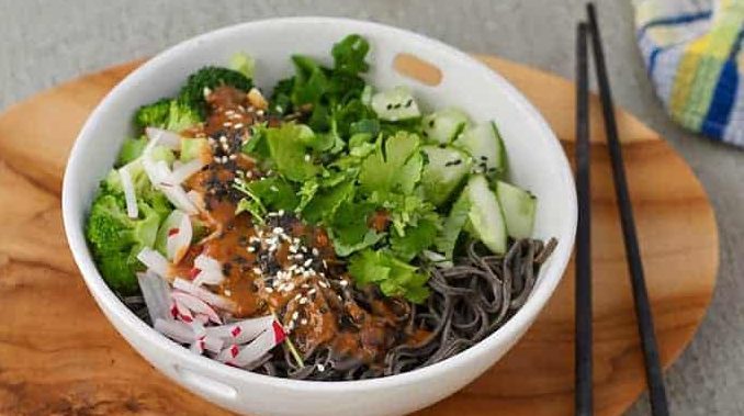 A bowl of spicy black bean noodles.