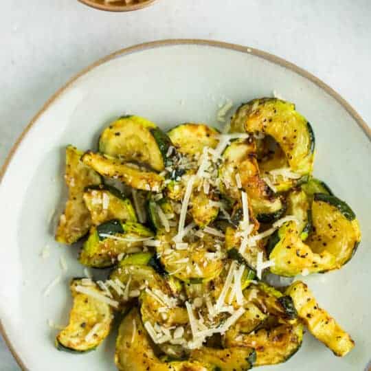 Air fryer zucchini on a plate.