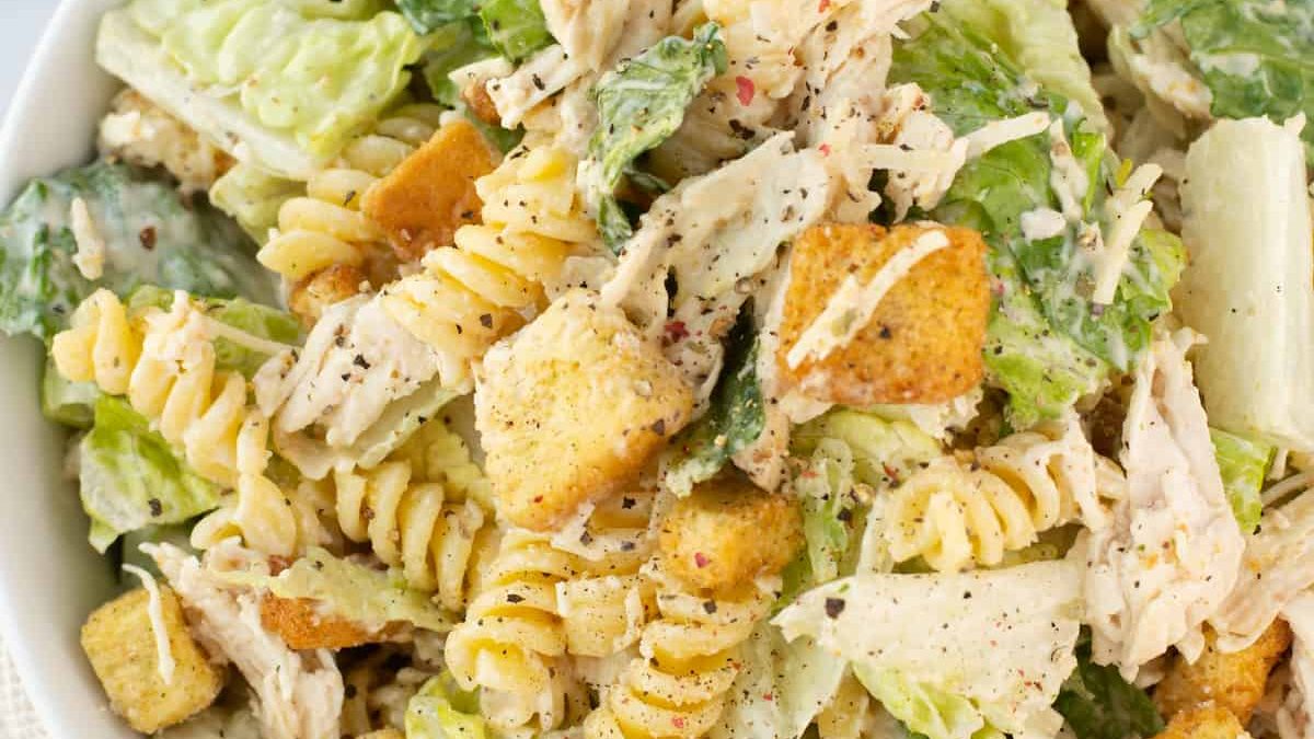 Caesar salad with chicken and pasta.