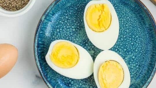 Halves of boiled egg on a plate.