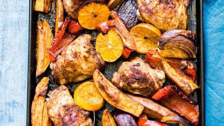Sheet pan with chicken and sweet potatoes.
