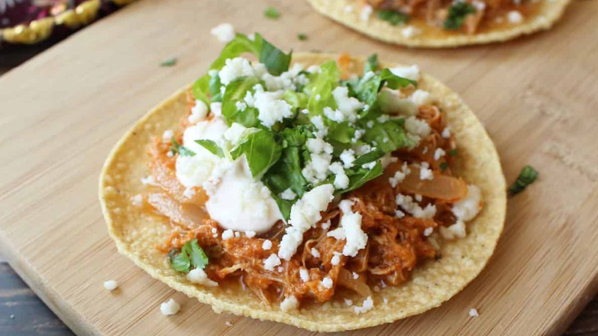 Chicken tinga on tortilla bread.