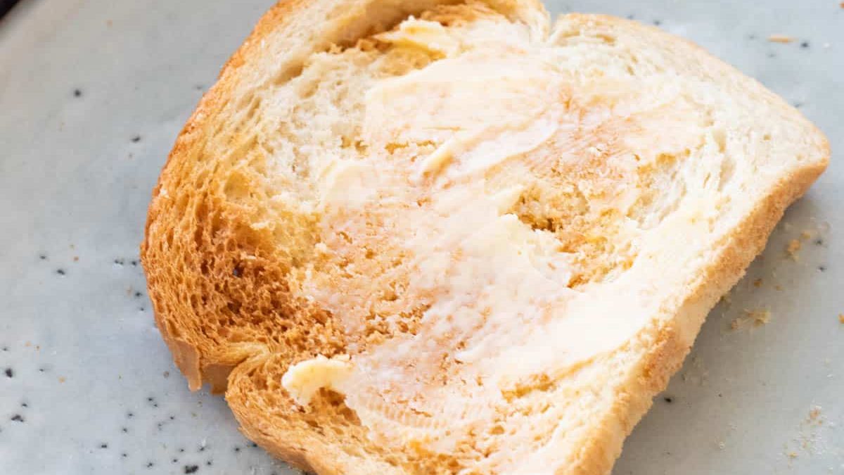 A slice of buttered air fryer toast.