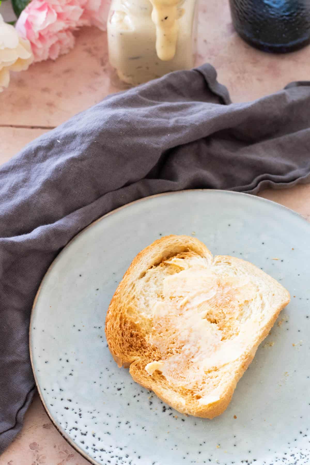 A slice of buttered air fryer toast.