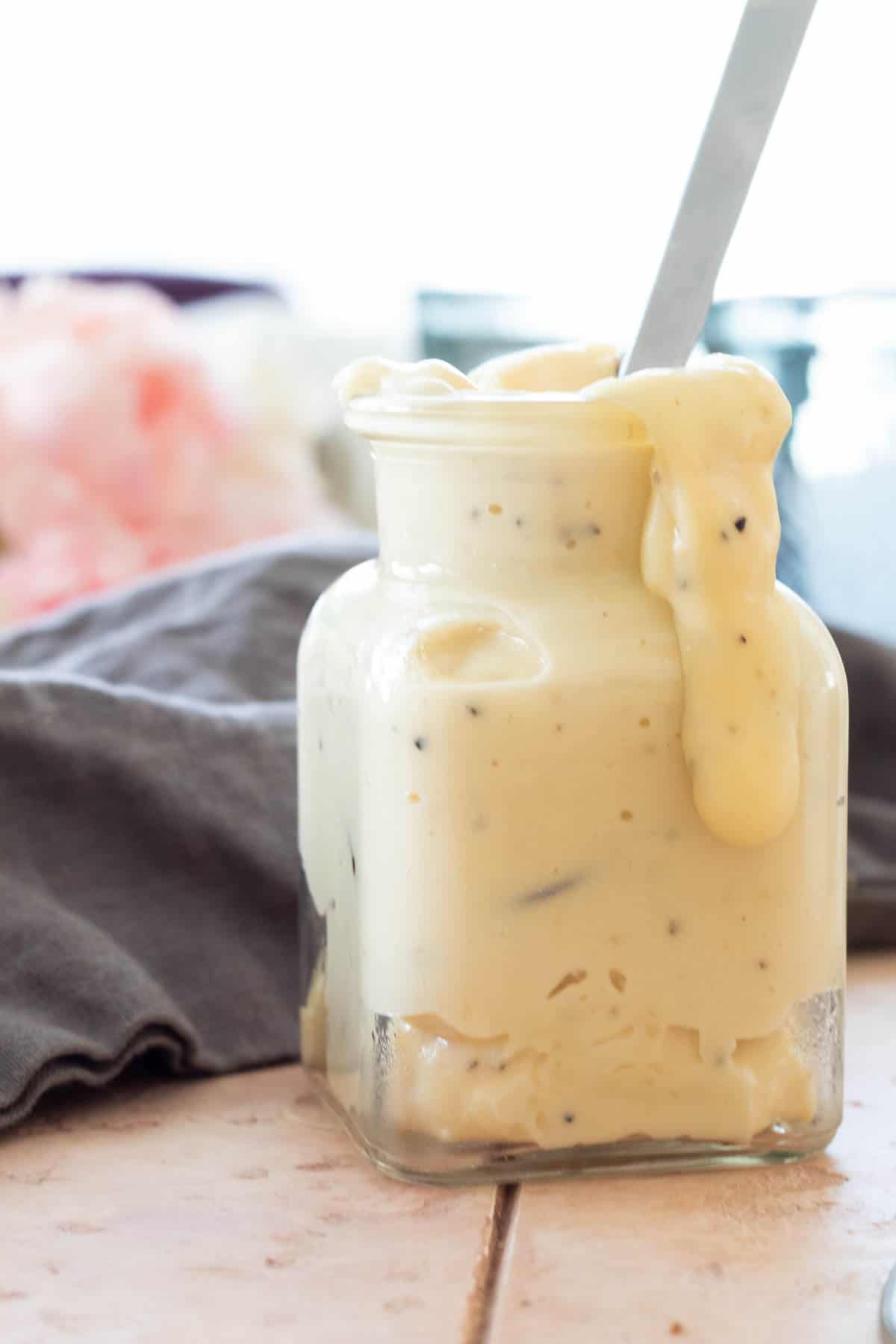 A jar of homemade garlic parmesan sauce.