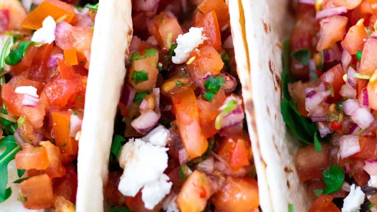 Tacos with black beans and feta cheese.