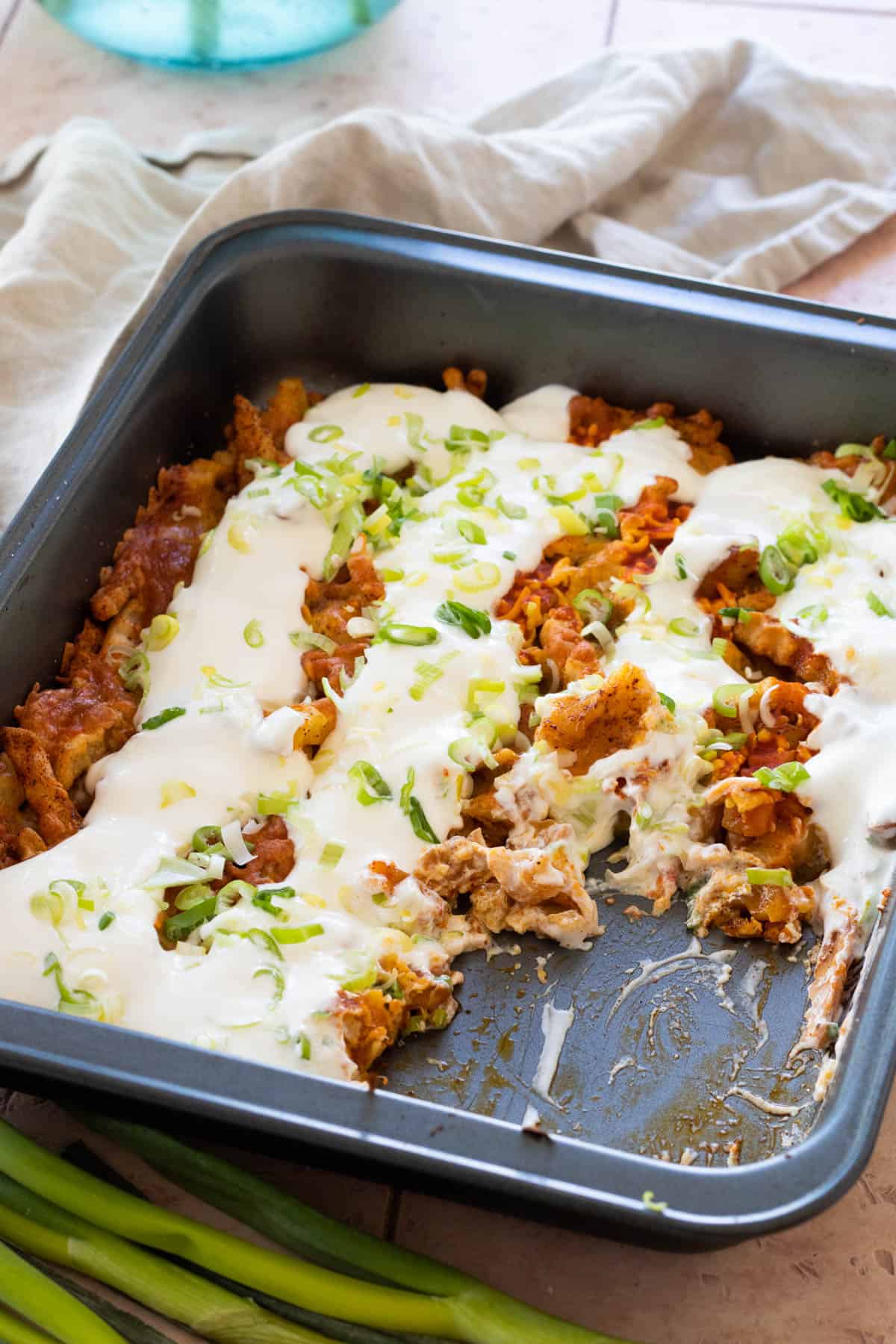 Leftover french fries casserole topped with sour cream.