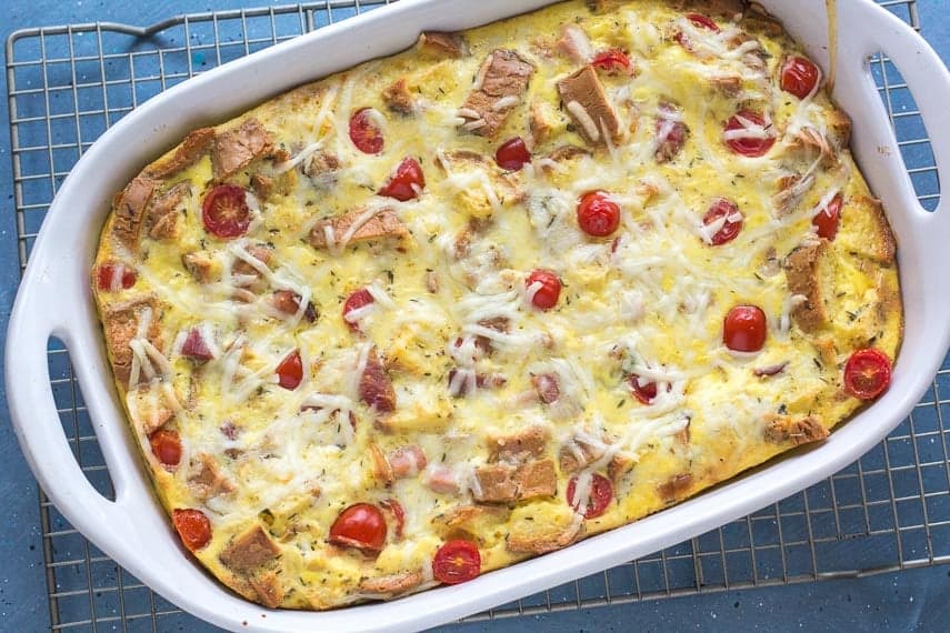 A dish filled with ham and cheese strata.