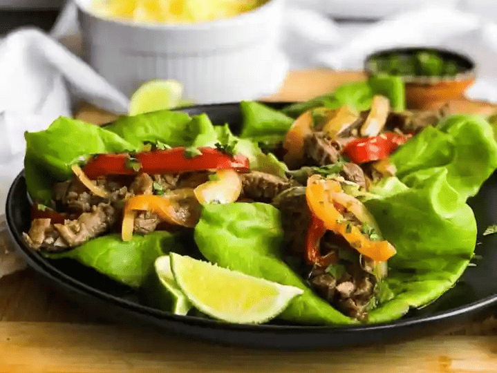 Carne asada on lettuce.