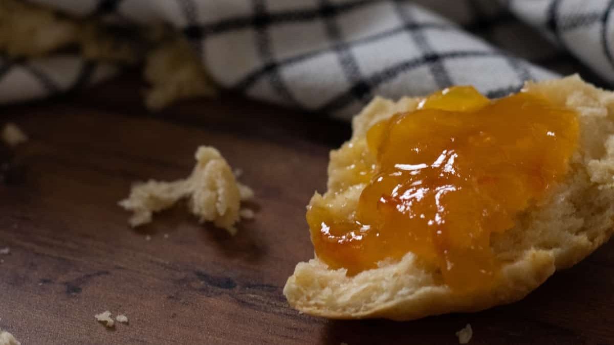 a scone topped with marmalade.