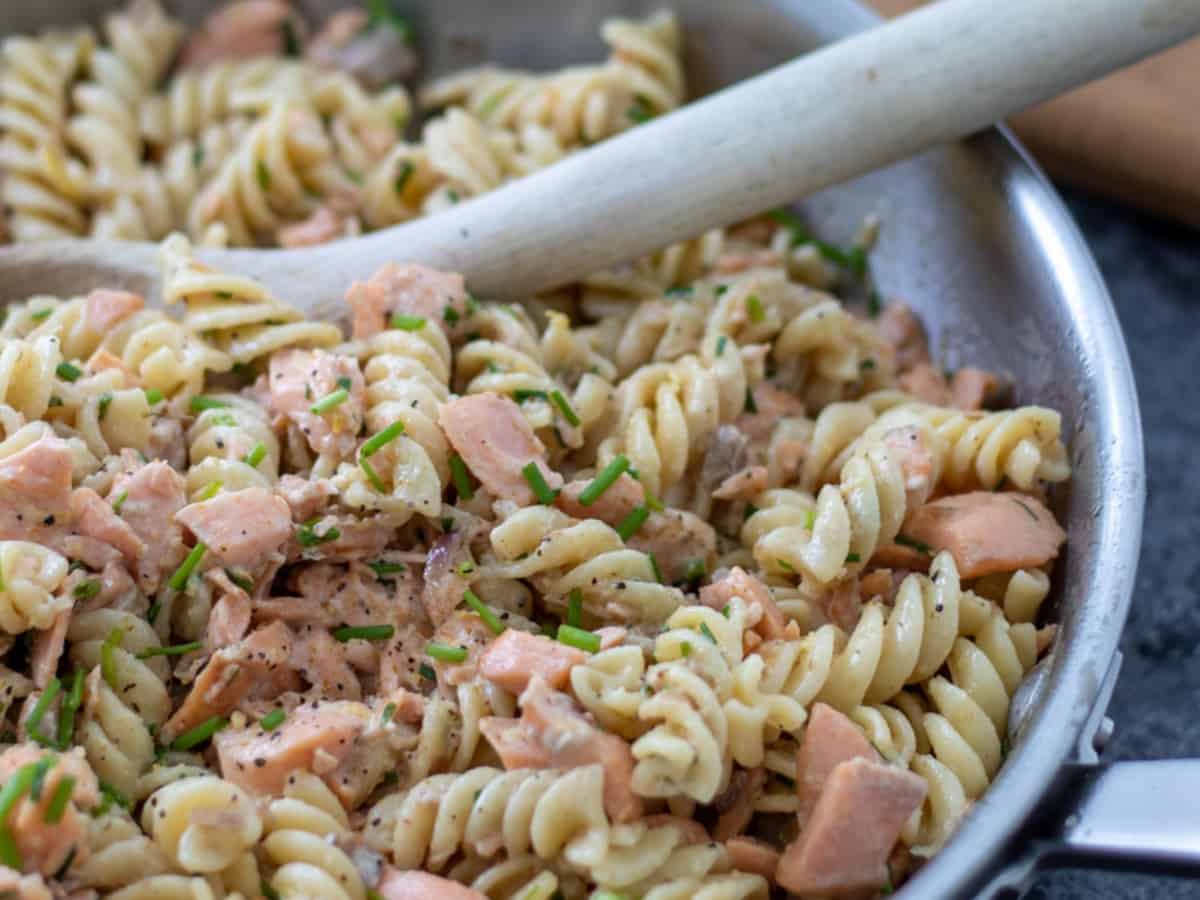 Salmon creme fraiche pasta in a pan.