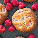 Raspberry muffins in a muffin tin.